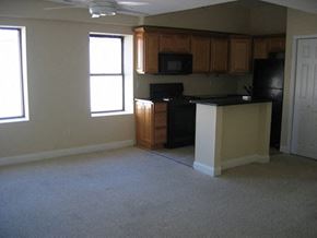 Philadelphia apartment for rent - an empty kitchen with an island in the middle of it