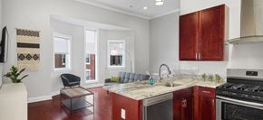 Philadelphia apartment for rent - a kitchen with a sink and a stove and a window