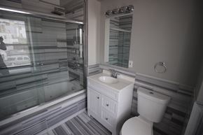Philadelphia apartment for rent - a bathroom with a sink toilet and a shower