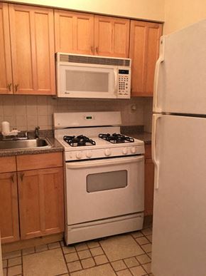 Philadelphia apartment for rent - a kitchen with a stove microwave and refrigerator