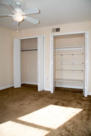 Philadelphia apartment for rent - an empty bedroom with a closet and a ceiling fan