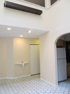 Philadelphia apartment for rent - a kitchen with white walls and a refrigerator and a sink