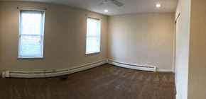 Philadelphia apartment for rent - an empty room with white walls and two windows