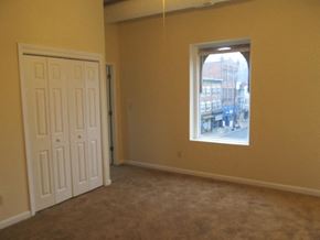 Philadelphia apartment for rent - an empty living room with a window and a door