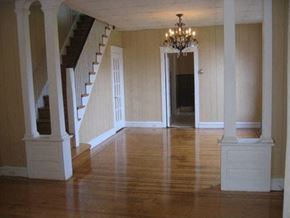 Philadelphia apartment for rent - a large empty living room with a chandelier