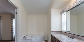 Aurora apartment for rent - a bathroom with a tub and a sink and a mirror