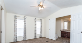 Aurora apartment for rent - a living room with white walls and a ceiling fan