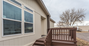 Aurora apartment for rent - a deck in front of a house with large windows
