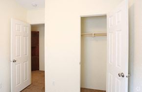 Lincoln apartment for rent - an empty bedroom with a closet and an open door