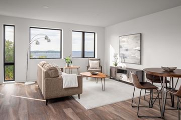 Burlington apartment for rent - a living room with a couch and chairs and a table