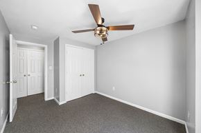 Philadelphia apartment for rent - a bedroom with white walls and a ceiling fan