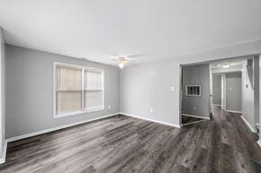 Philadelphia apartment for rent - the living room of a new home with wood flooring and a large window