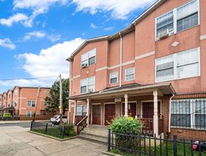 Philadelphia apartment for rent - a brick apartment building with a sidewalk in front of it