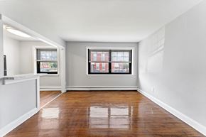Philadelphia apartment for rent - an empty living room with wood floors and a window