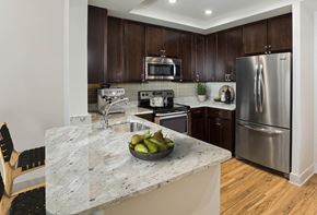 Hanover apartment for rent - a kitchen with stainless steel appliances and a marble counter top