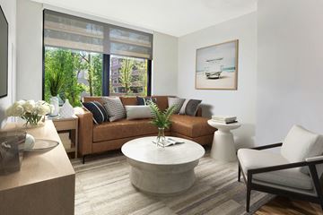 Hanover apartment for rent - a living room with a brown couch and a large window
