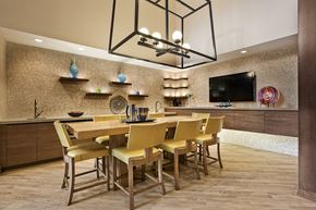 Hanover apartment for rent - a dining room with a long table and chairs under a chandelier