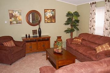 Grand Island apartment for rent - a living room with couches and a table