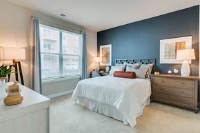 Laurel apartment for rent - a bedroom with a bed and a window