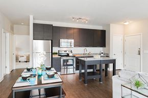 Laurel apartment for rent - a kitchen and living room with an island and a refrigerator