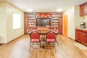Port Charlotte apartment for rent - library with TV, shelves full of books, reading table, and coffee station