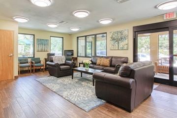 Port Charlotte apartment for rent - a living room with couches and chairs and a table
