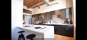 Milwaukee apartment for rent - Living room and kitchen at Maxwell lofts in Milwaukee, WI.