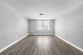 Philadelphia apartment for rent - A room with wooden flooring and a window.