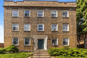 Philadelphia apartment for rent - the front of a brick building with a blue door