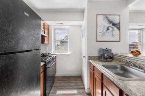 Philadelphia apartment for rent - a kitchen with a sink and a refrigerator