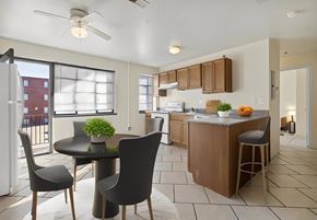 St. Louis apartment for rent - an open kitchen and dining area with a table and chairs