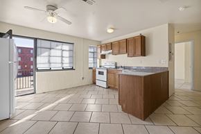St. Louis apartment for rent - an empty kitchen with a door to a balcony