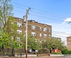 Philadelphia apartment for rent - a brick apartment building with trees in front of it