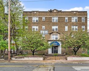 Philadelphia apartment for rent - a brick building with trees in front of it on a street