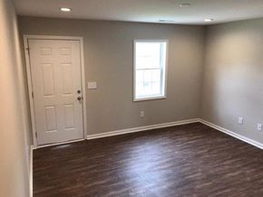 Rocky Mount apartment for rent - a empty room with a white door and a window