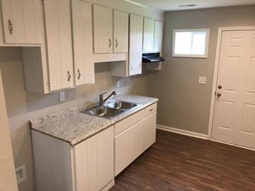 Rocky Mount apartment for rent - a kitchen with a sink and white cabinets