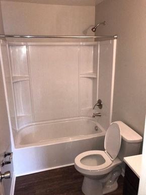 Rocky Mount apartment for rent - a white bathroom with a toilet and a shower