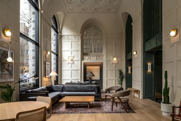 Chicago apartment for rent - a living room with a couch and a fireplace