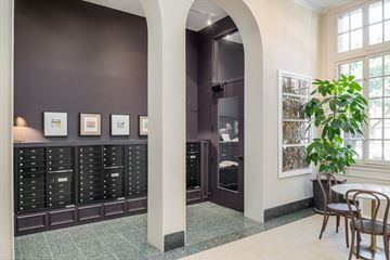 Chicago apartment for rent - a dining room with a table and chairs and a large cabinet with drawers