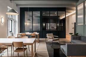 Chicago apartment for rent - A modern dining room with a long table and chairs.