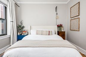Chicago apartment for rent - a bedroom with a white bed and a window