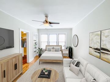 Chicago apartment for rent - A living room with a white couch and a wooden coffee table.
