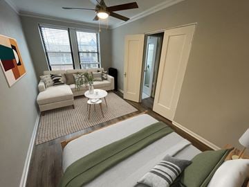 Chicago apartment for rent - A living room with a couch, a chair, and a painting on the wall.
