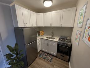 Chicago apartment for rent - A kitchen with a stove, sink, and refrigerator.