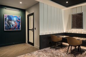Chicago apartment for rent - a dining room with a table and chairs and a painting on the wall
