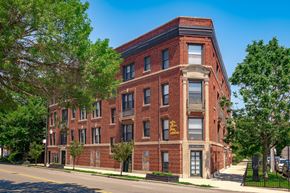 Chicago apartment for rent - a red brick building on the side of a street