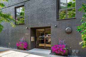 Chicago apartment for rent - the front of a brick building with a door and flowers