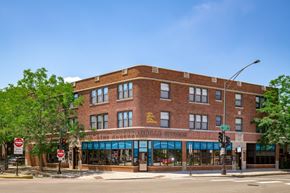 Chicago apartment for rent - a red brick building on the corner of a street