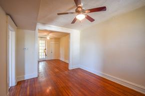 Richmond apartment for rent - an empty living room with wood floors and a ceiling fan