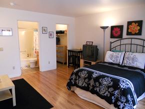 Madison apartment for rent - a bedroom with a bed and a bathroom with a toilet and a sink